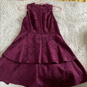 A mid length purple dress with a slight shimmer.